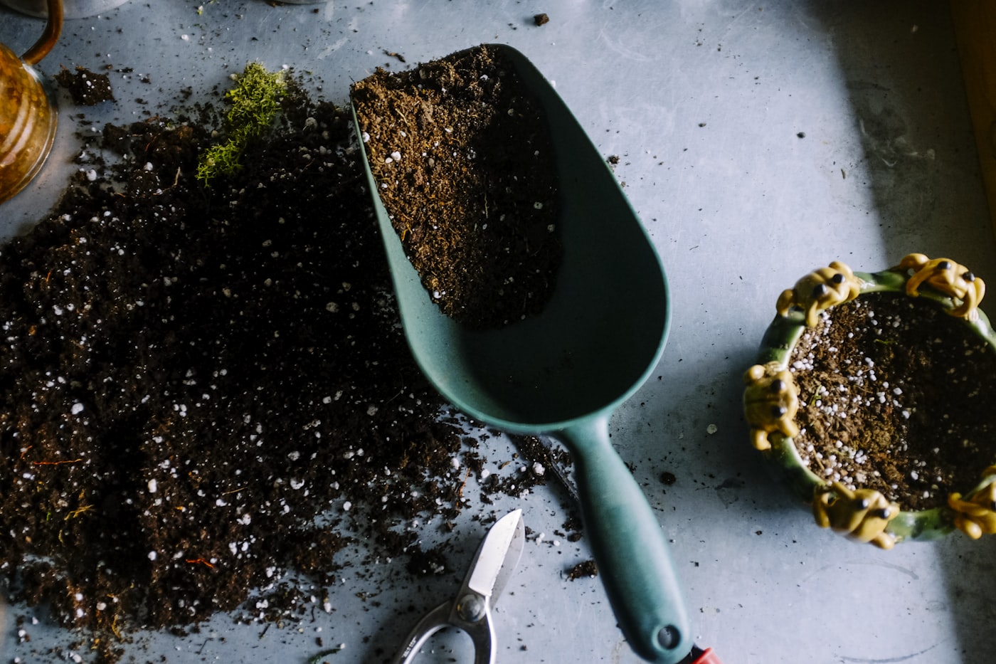 Garden soil and hand tools during bed preparation